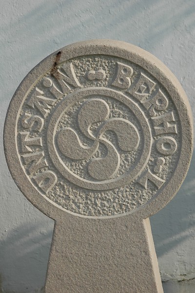 A stele from a Basque cemetery, with Basque writing and the lauburu. <a href=></a>