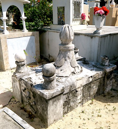 The empty grave of Fermin Antonio Mundaca y Marecheaga in the Isla Mujeres Cemetery. He is given credit for carving the skull and crossbones. <a href=></a>