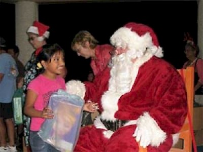 Chelem children enjoying a visit from Santa Claus in Yucatan <a href=></a>